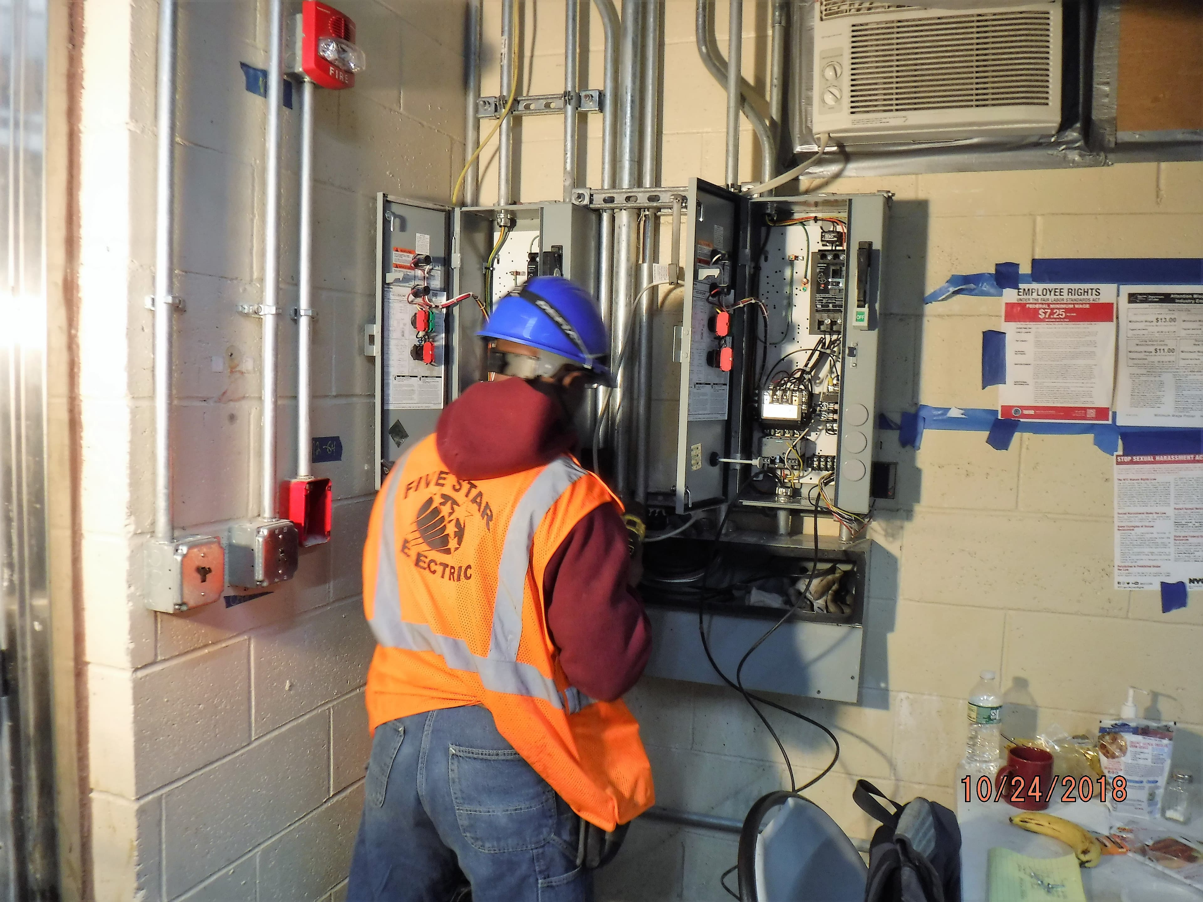 Electrical professional at work